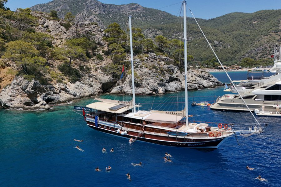 Daytime leisure on a gulet during Blue Cruise in Turkey – swimming and sunbathing in turquoise waters