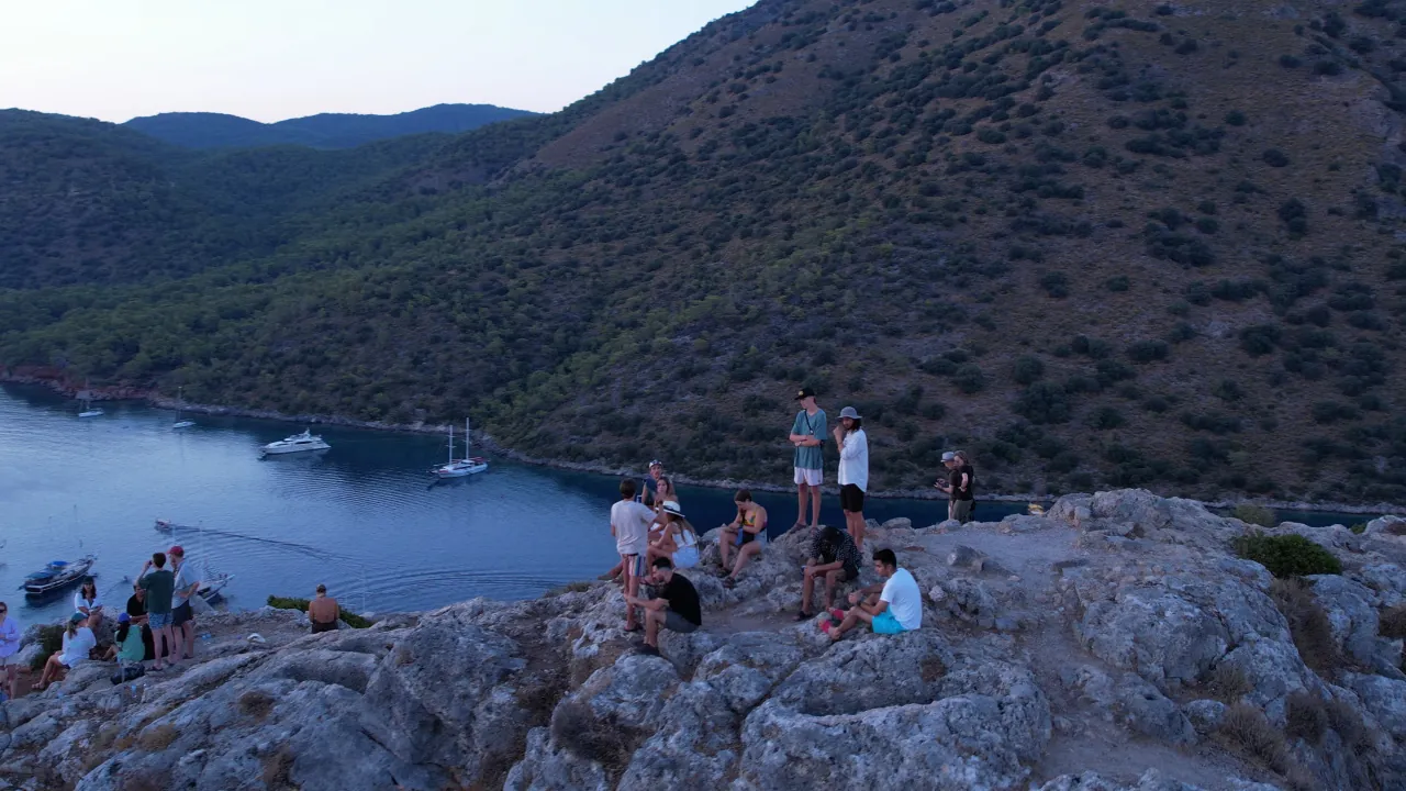 Watching the sunset from boat and hills during Blue Cruise in Turkey – panoramic view