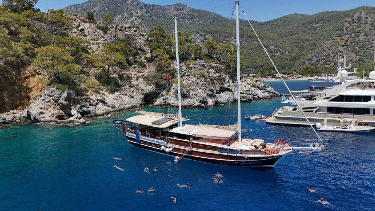 Daytime leisure on a gulet during Blue Cruise in Turkey – swimming and sunbathing in turquoise waters