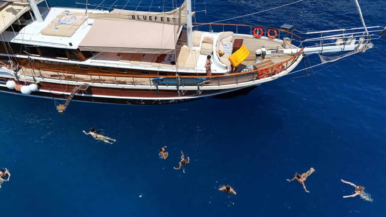 Swimming and relaxing on a gulet boat during daytime Blue Cruise in Turkey – turquoise waters