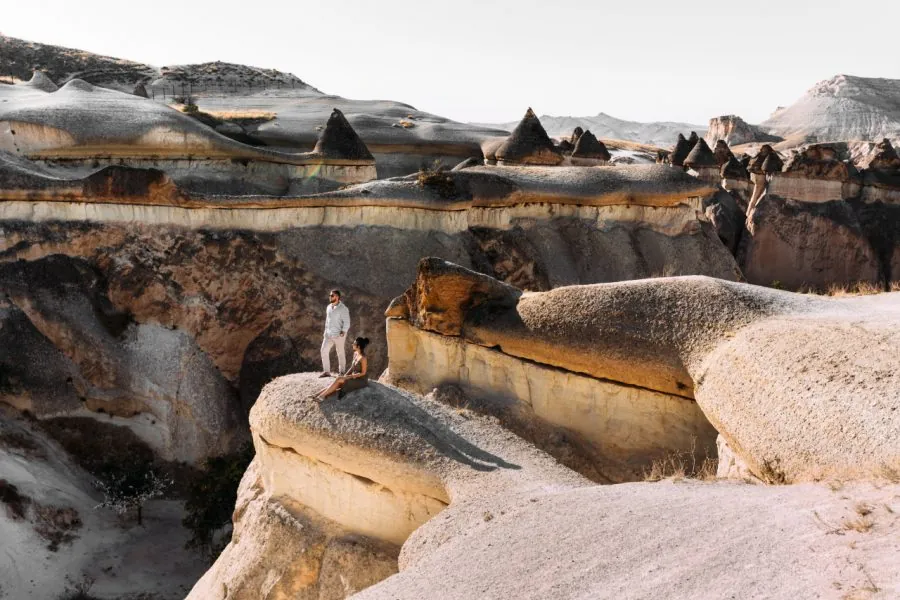 Hikers exploring the scenic valleys of Göreme in Cappadocia, Turkey – unique rock formations and fairy chimneys