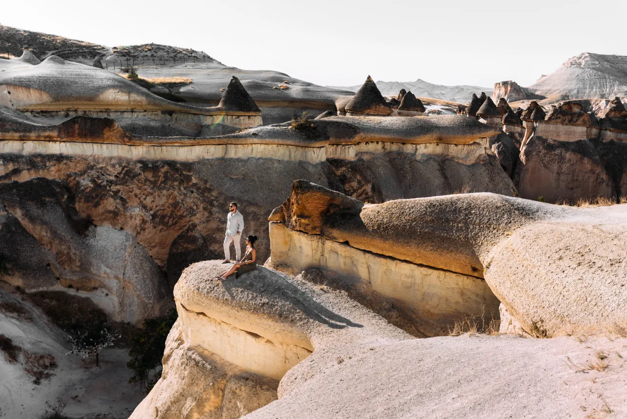 Hikers exploring the scenic valleys of Göreme in Cappadocia, Turkey – unique rock formations and fairy chimneys