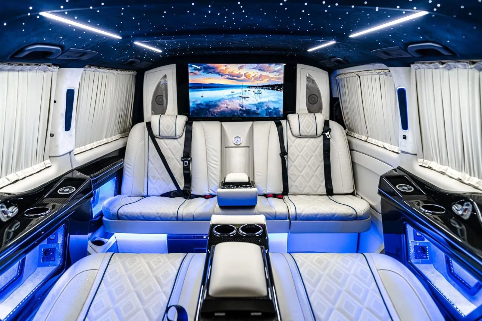 Interior of a VIP Mercedes Vito with comfortable leather seats, spacious cabin, and modern amenities for private transfers
